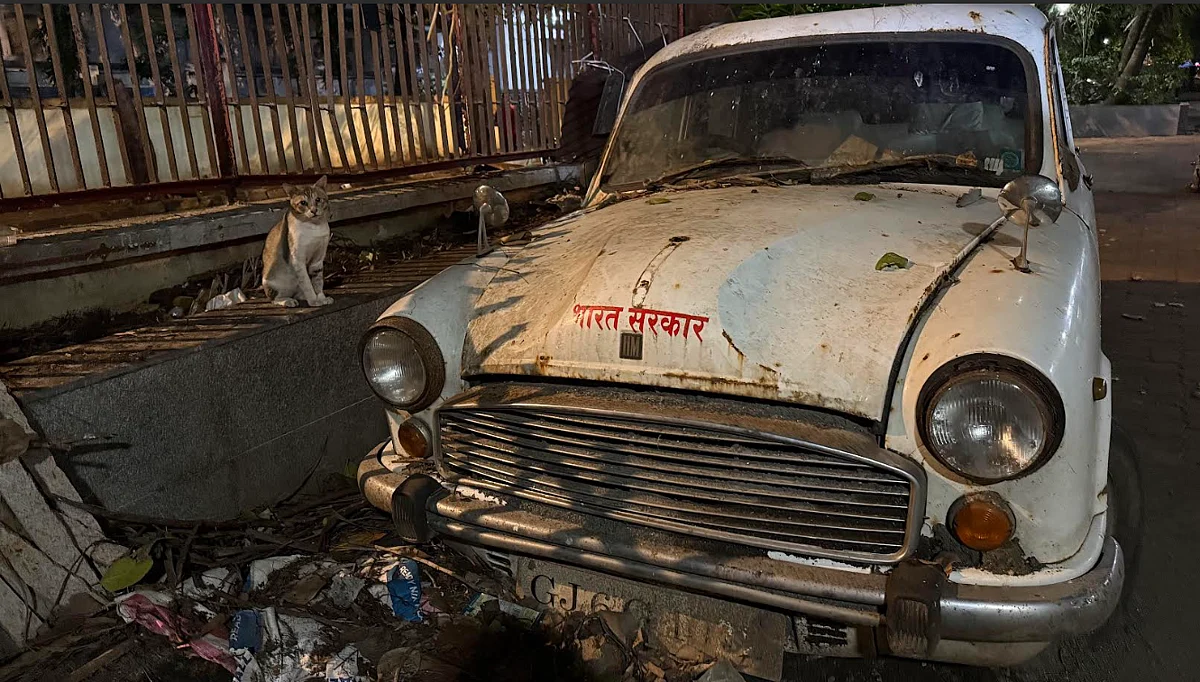 Rusting Ambassador and other abandoned cars near Nishtha Bhavan, New Marine Lines, Mumbai