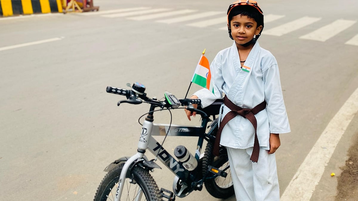 Young Karate Champ Cycles on Independence Day, Promotes Fitness
