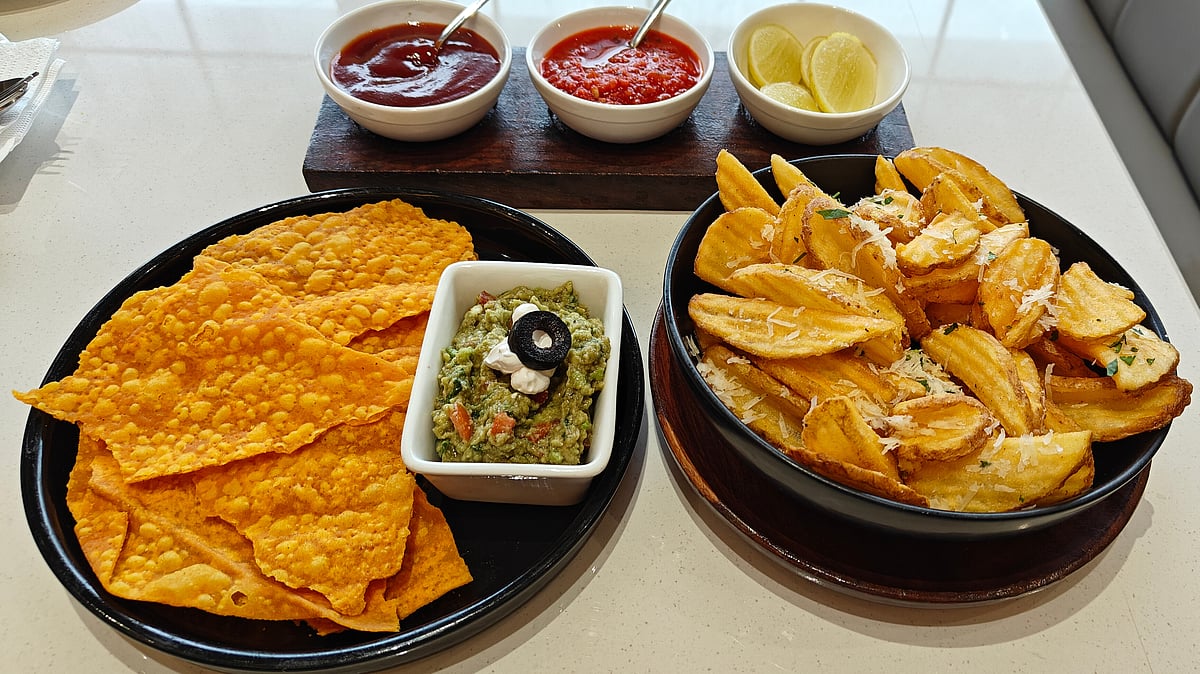 (Left) Guacamole with Tortilla Chips and (right) Truffle Fries