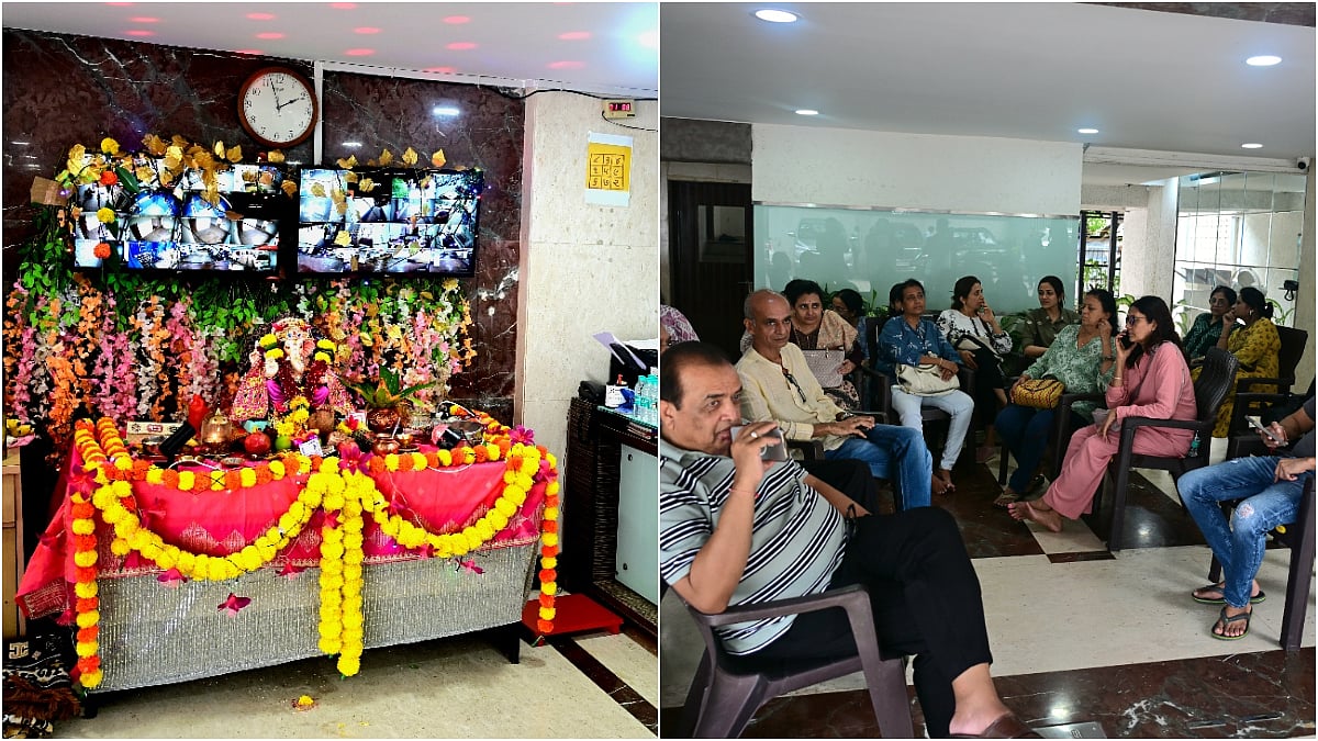 Residents of Willingdon Heights, Tardeo, sit in the lobby after vacating 17th–34th floor flats following Bombay High Court’s order