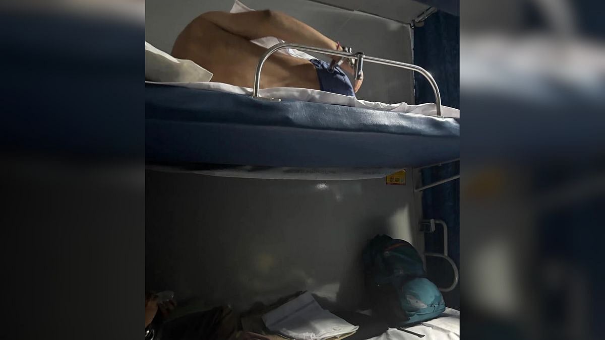Shirtless Passenger Was Seen Tied To Handcuffs While Travelling In Rajdhani Express, Netizens Speculate Who He Could Be On Viral Post