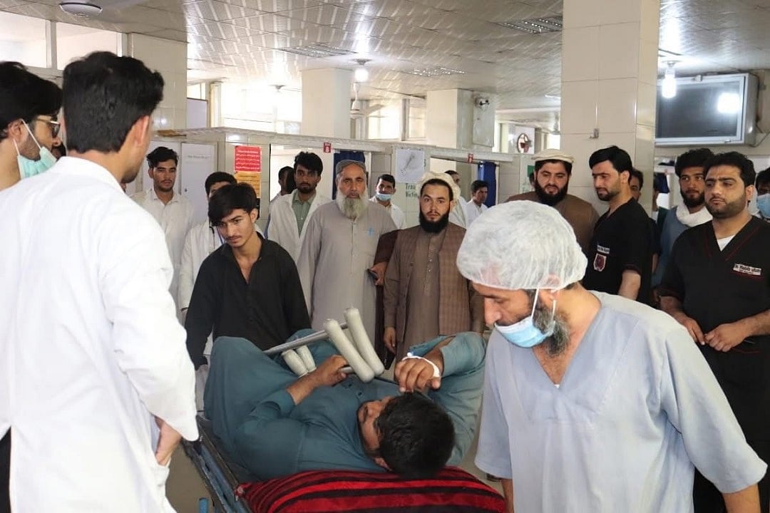 Injured survivor being tended to at a crowded emergency ward in Kunar after the earthquake wreaked havoc across the region.