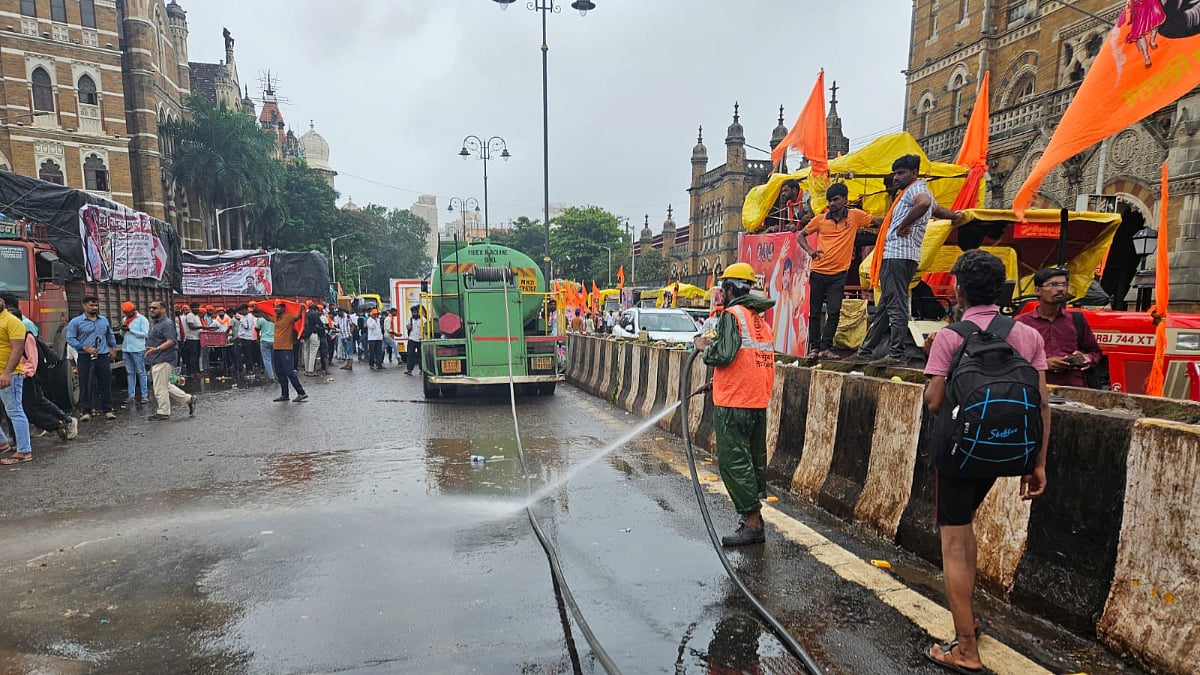 Water sprayed to clean road outside CSMT