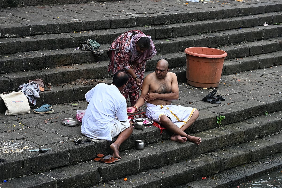 Devotees offer prayers and pay homage to their ancestors
on the first day of Pitru Paksha at Banganga Tank