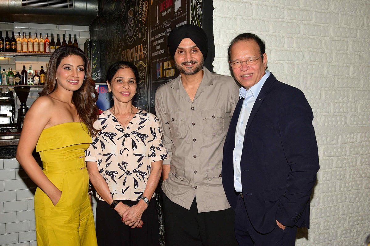 Harbhajan Singh, Geeta Basra pose with Ashok Dhamankar