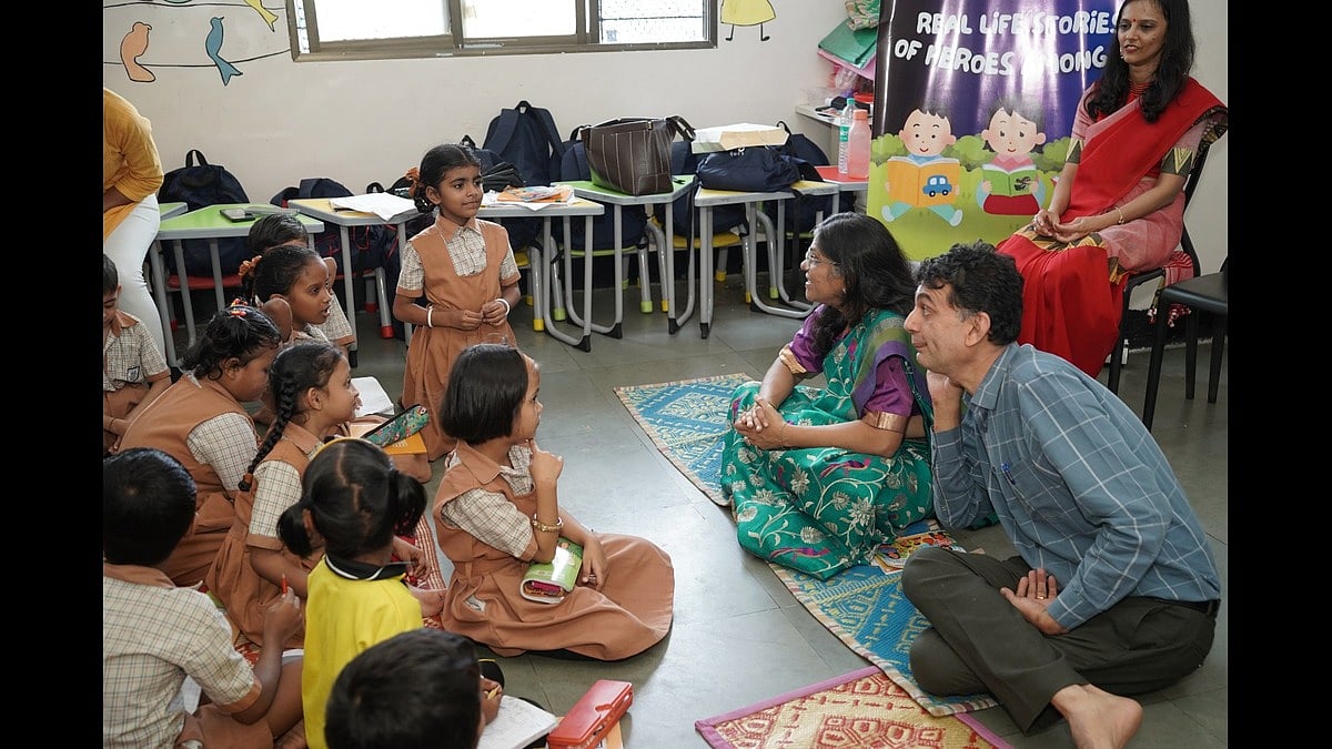 Abodh Aras and Monisha Narke interacting with the young students