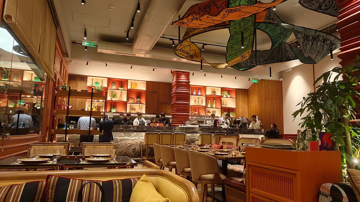 A curved installation floating around the seating area