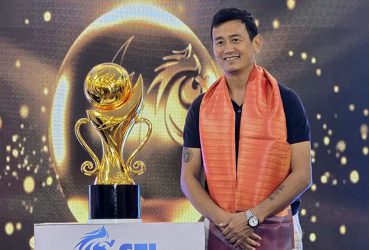 Bhaichung Bhutia with the SFL League trophy