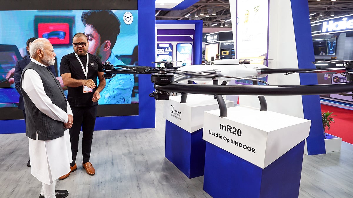 Prime Minister Narendra Modi inspects the mR-20 Drone, used in Operation Sindoor, during a walkthrough of the exhibition of Uttar Pradesh International Trade Show, in Greater Noida on Thursday. (DPR PMO/ANI Photo) |