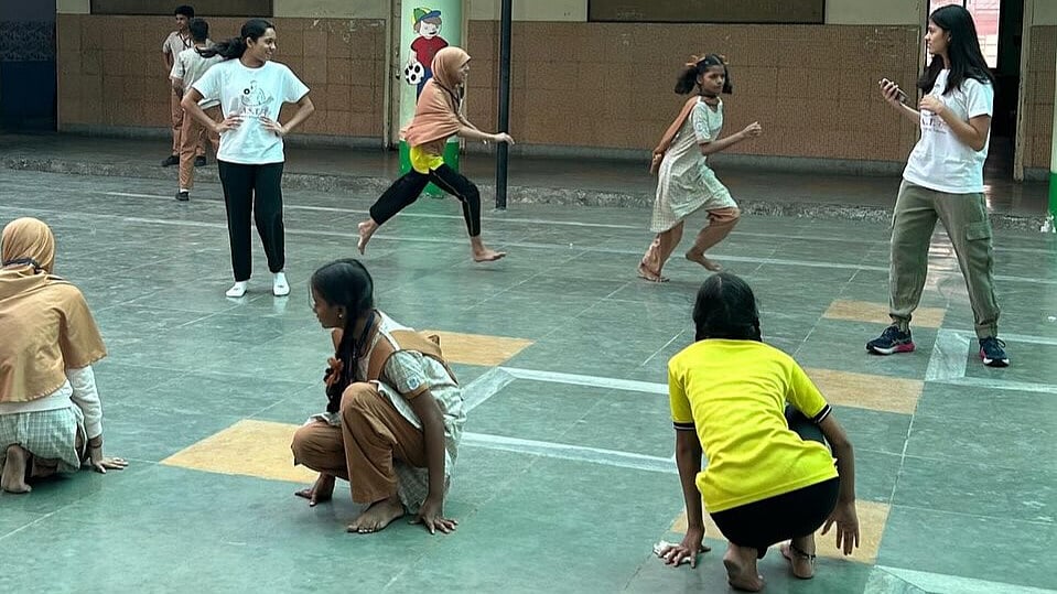 The girls play a game of kho kho