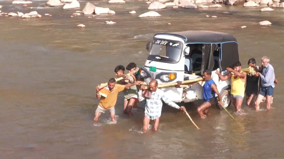 J&K: Locals Carry Auto Rickshaw On Shoulders After Key Bridge Gets Washed Away Due To Heavy Rains In...