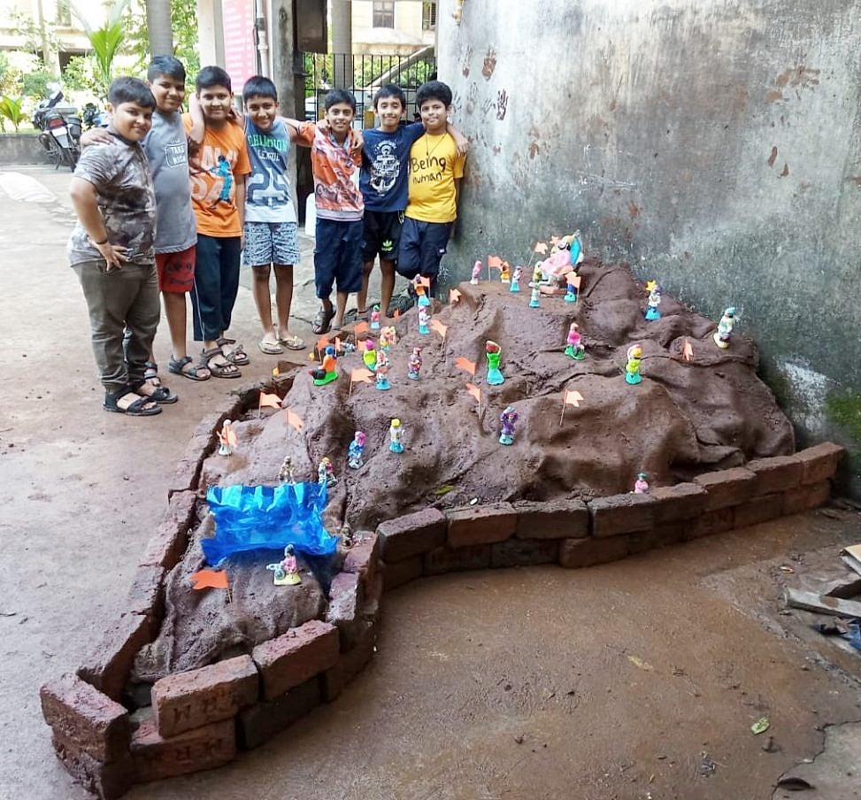 Kids posing after building their Killa (mud fort)