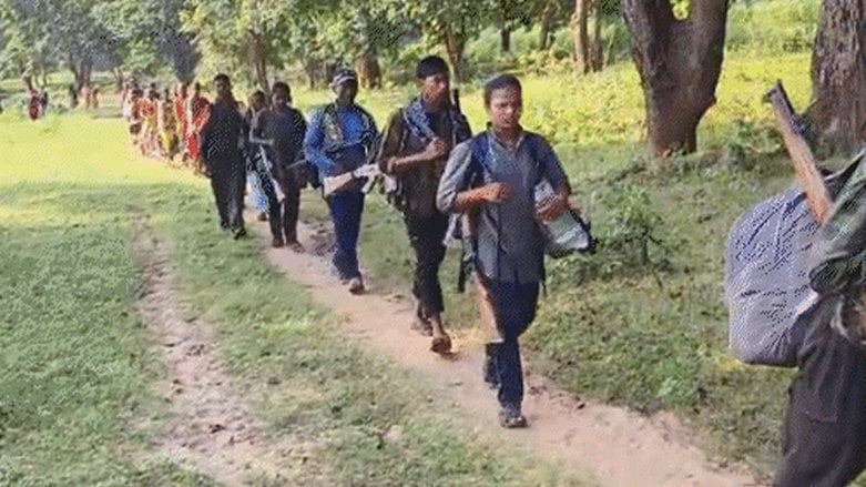 Photo of local journalist Ankur with Naxal cadres going to surrender