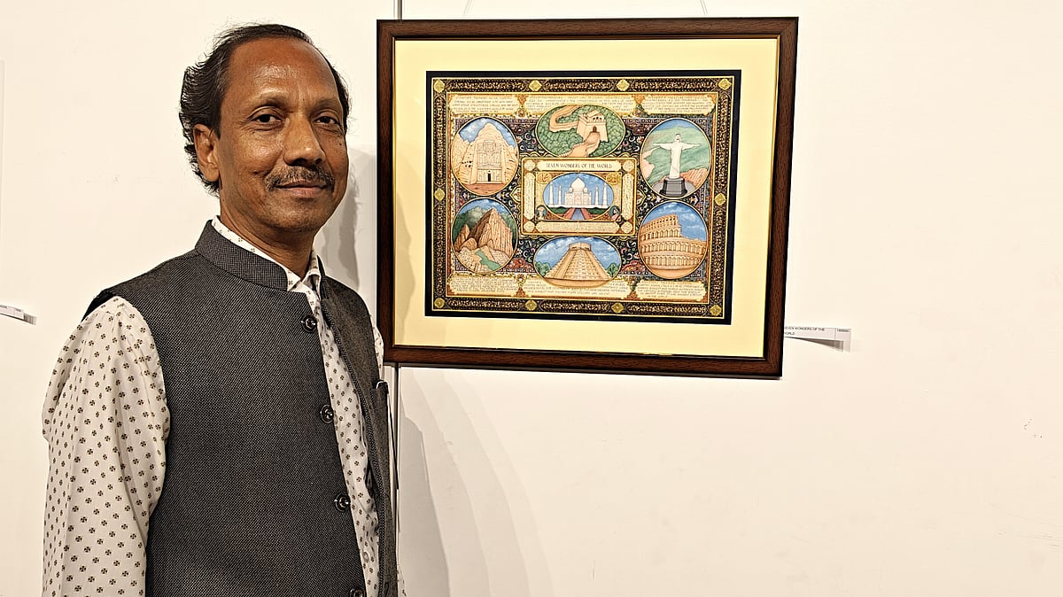 Hari Narayan Marotia with his miniature artwork that depicts the seven wonders of the world 
