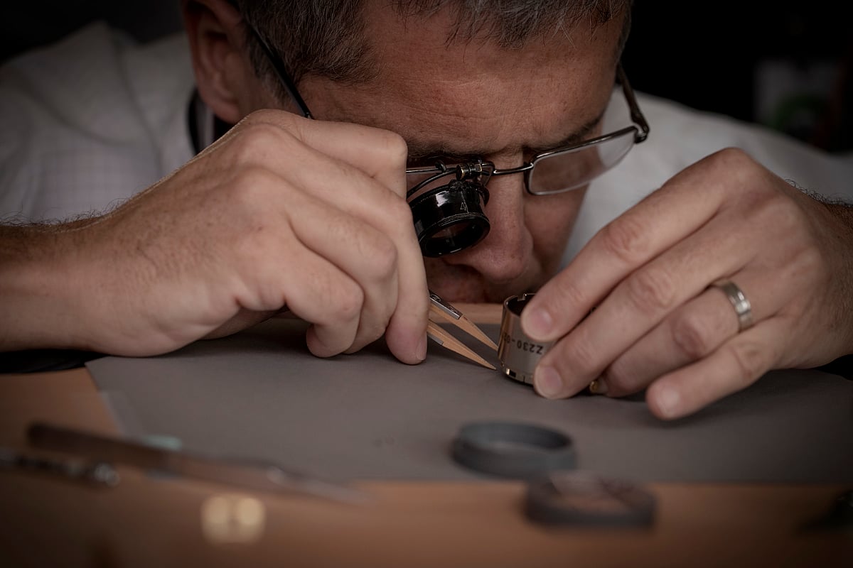 A watchmaker works on a Grand Complication at the Chopard manufacture