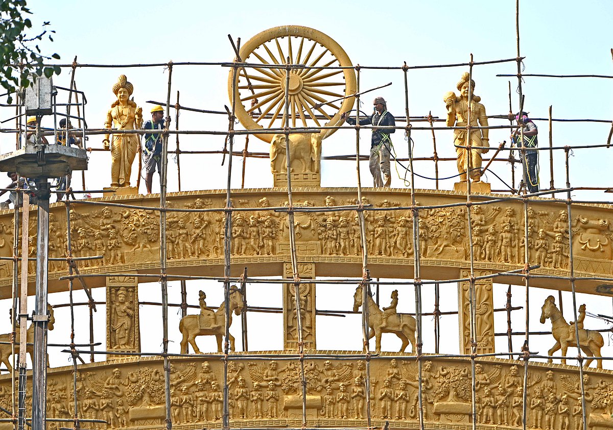 Workers repairing and painting the replica of the Sanchi Stupa at Dadar Chaityabhoomi ahead of Mahaparinirvana Day, the death anniversary of B. R. Ambedkar.