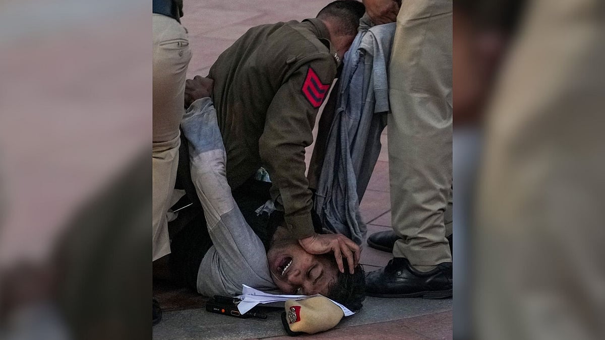 Viral Photo Shows Youth Pinned Face-Down By Cop At Delhi's India Gate After Protesters Raised 'Long...