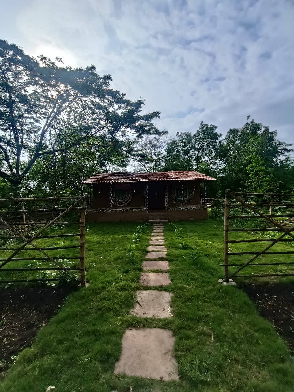 A traditional mud house gives students a glimpse into rural life and how communities have coexisted with nature for centuries.
