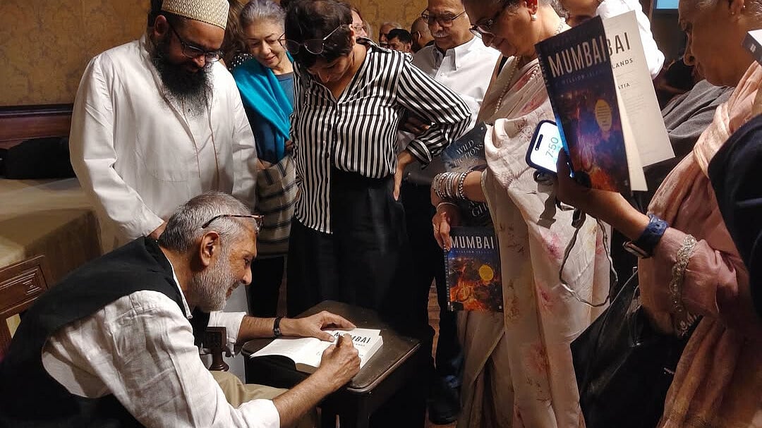 Sidharth signs copies of his book