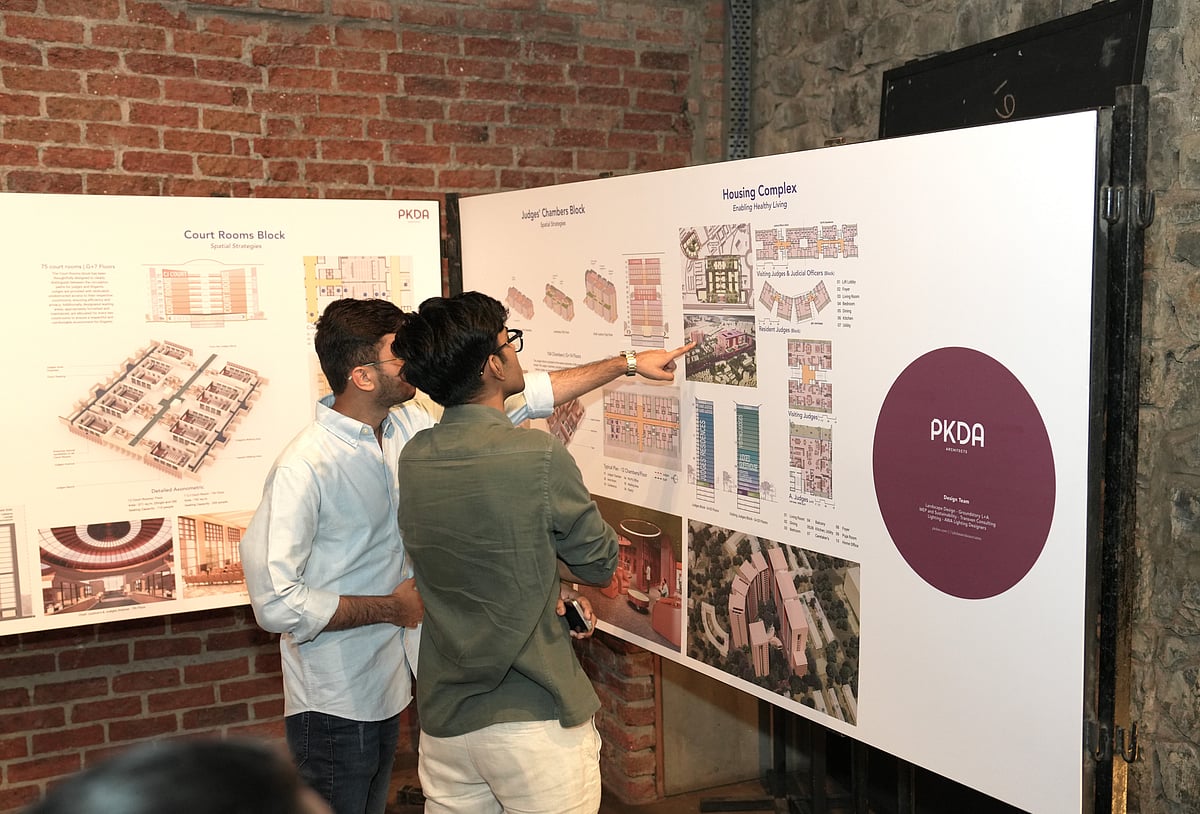 Visitors observing the detailing of designs at the exhibition organised by Mumbai Architects Collective