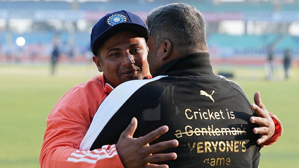 Sarfaraz Khan with his father. | (Credits: Twitter)