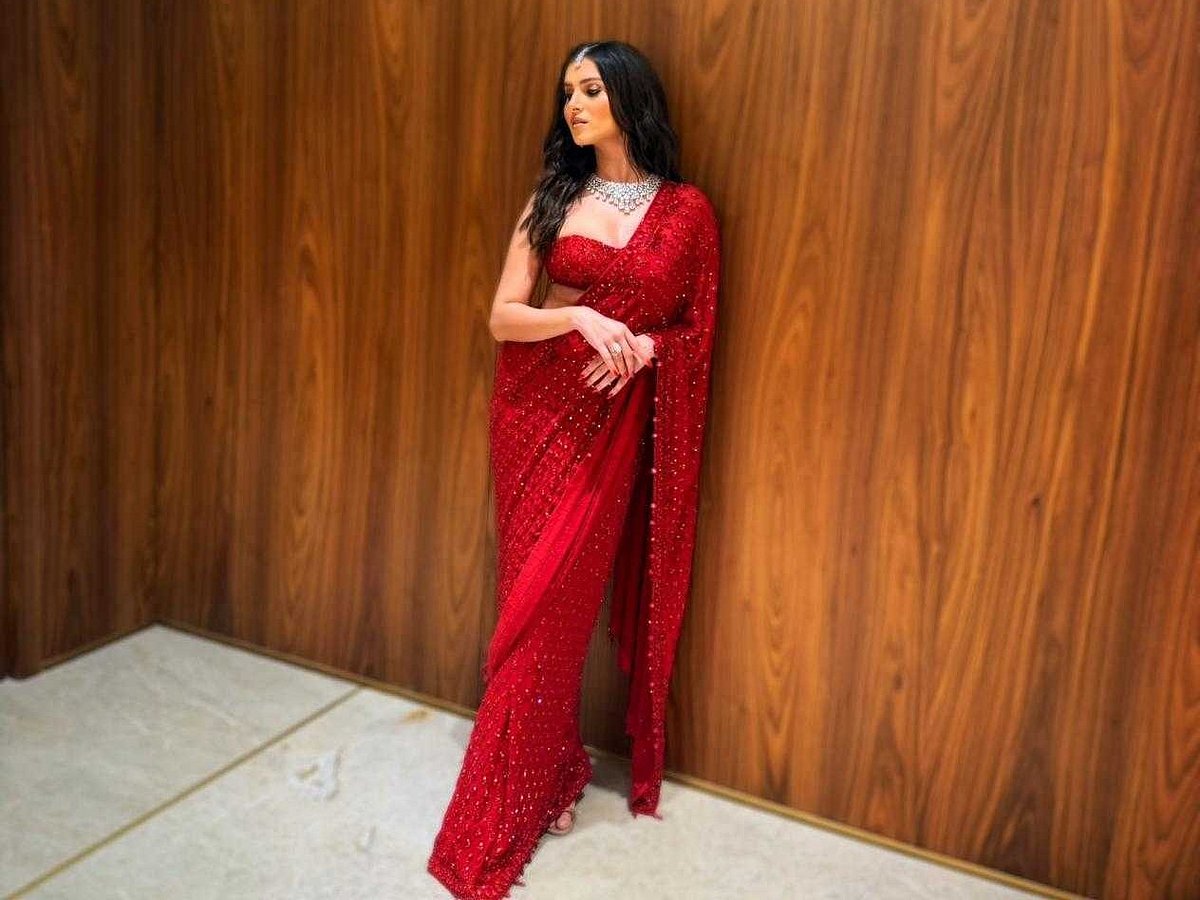 Tara in red saree by Arpita Mehta