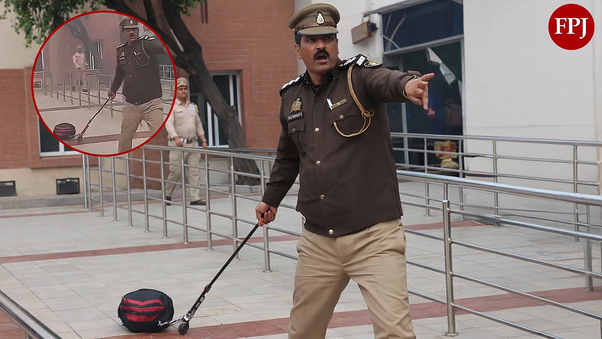 Viral Video Shows UP Police Officer Carrying Suspicious Bag With Bare Hands & Stick After Bomb...
