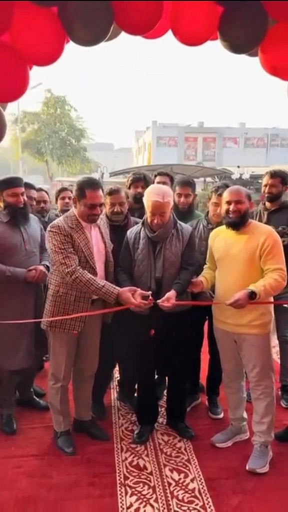 Khawaja Asif inaugurating unauthorised Pizza Hut store in Sialkot