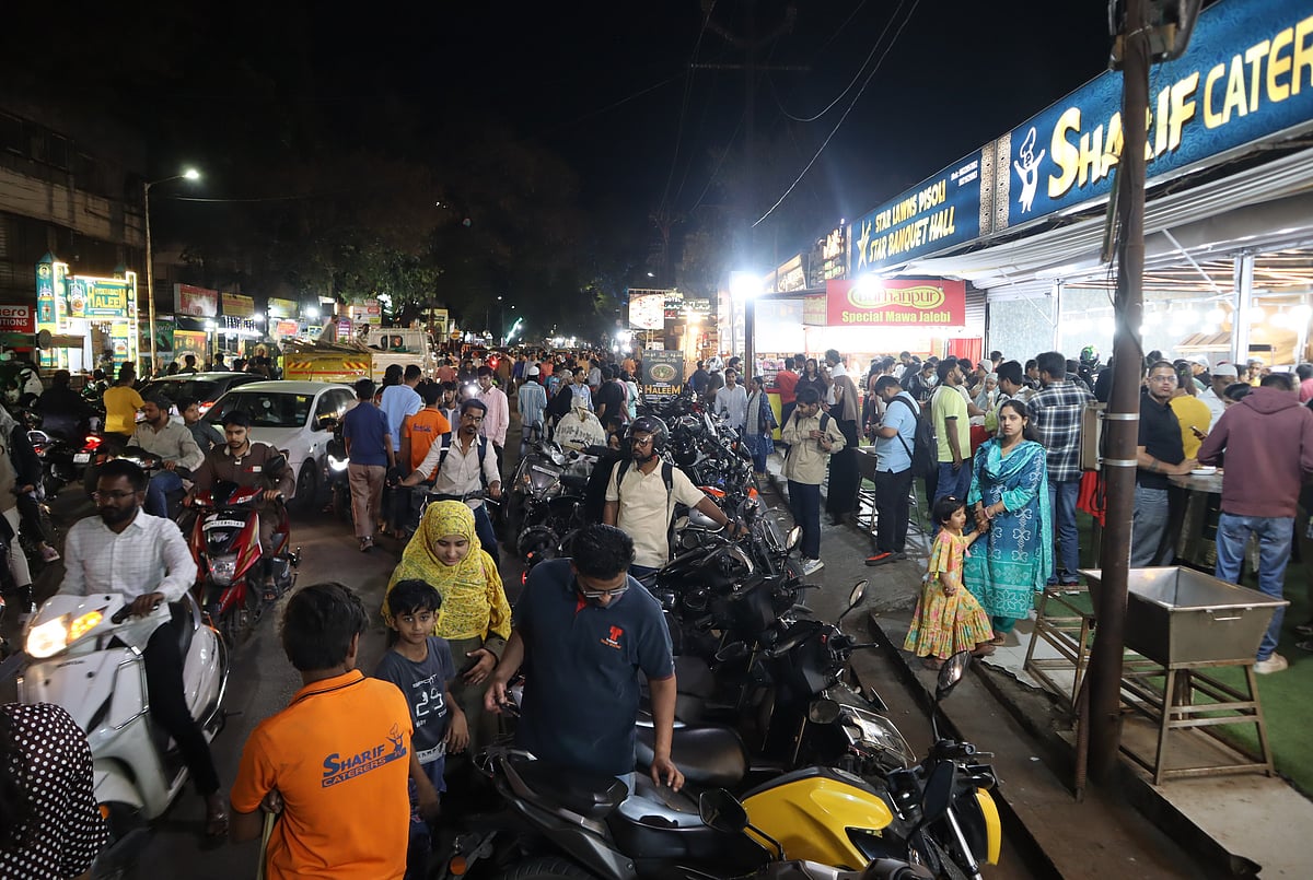 Families and friends gather to eat together after sunset