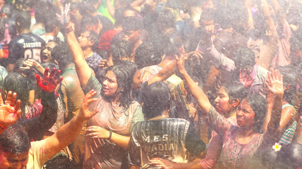 Participants celebrate the festival of colours with music, laughter and traditional Holi greetings at the Rang Barse event.