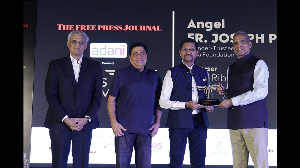 Dr Edsel Pereira receives the award on behalf of Padma Shri Fr Joseph Pereira,
Founder-trustee, Kripa Foundation, from Maharashtra State Election Commission secretary Dr Suresh Kakani (IAS)