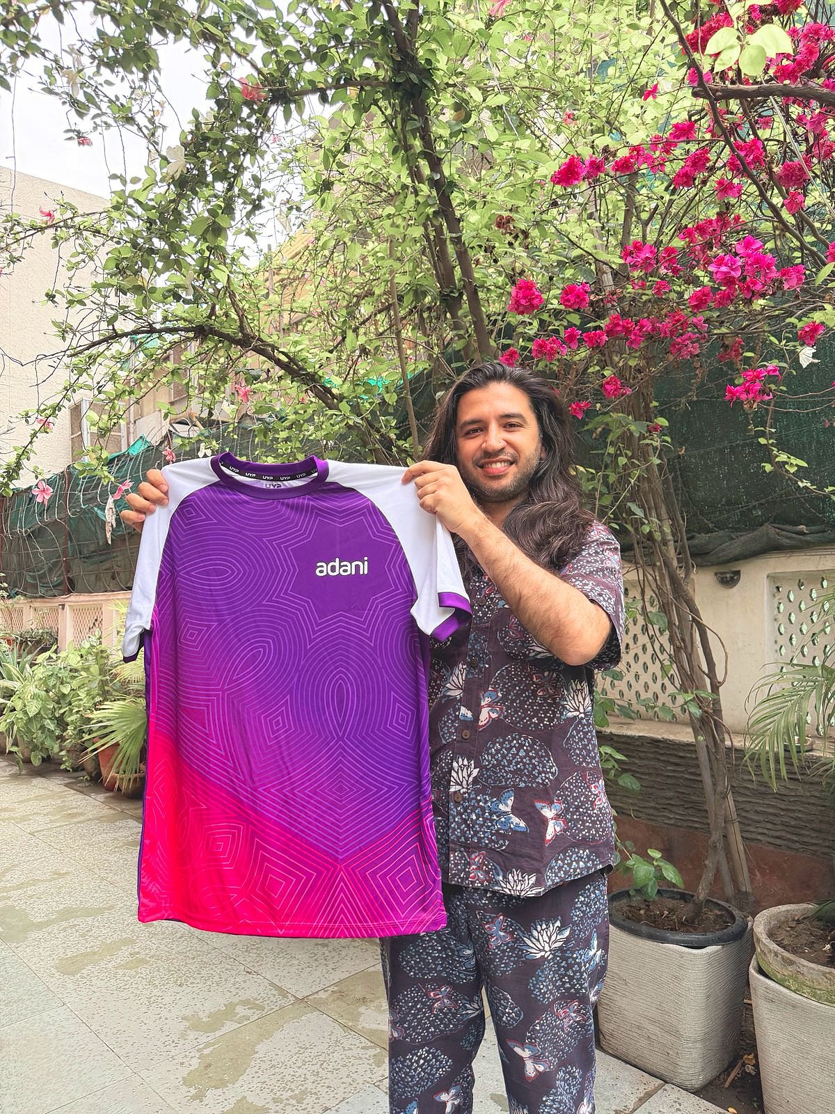 Aaquib Wani holding the Jersey