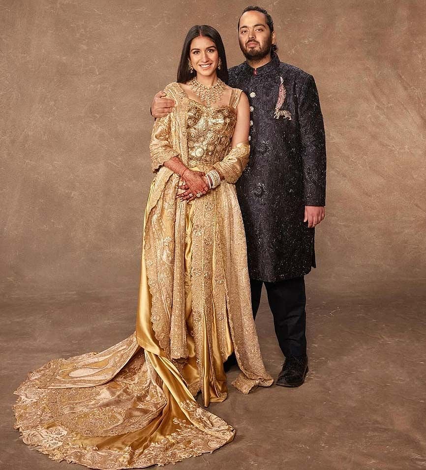 Tiger brooch with pink feather