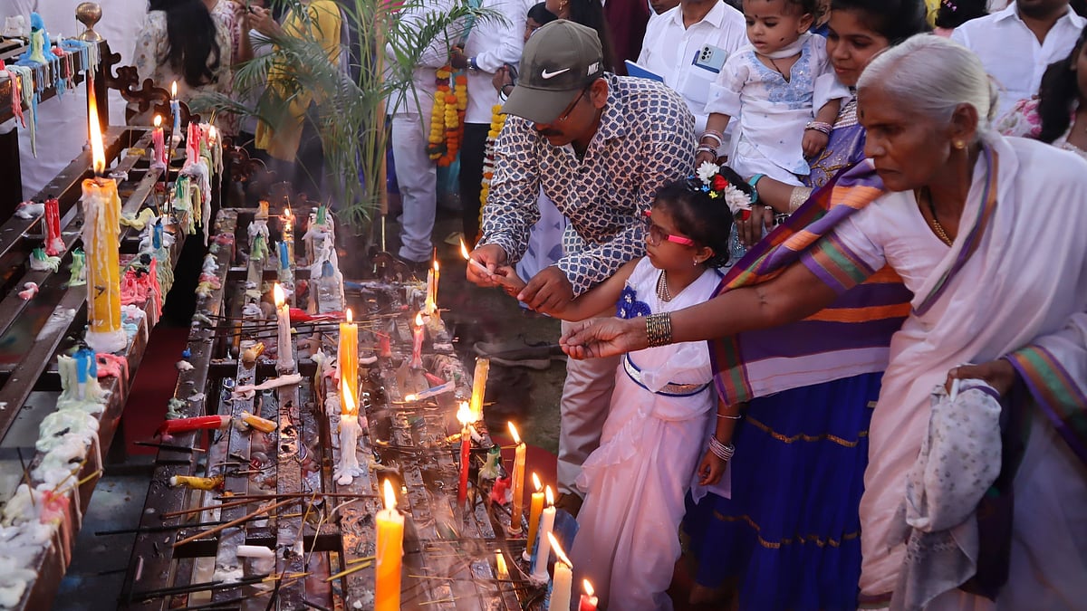 Devotees lit candles as a mark of respect and remembrance