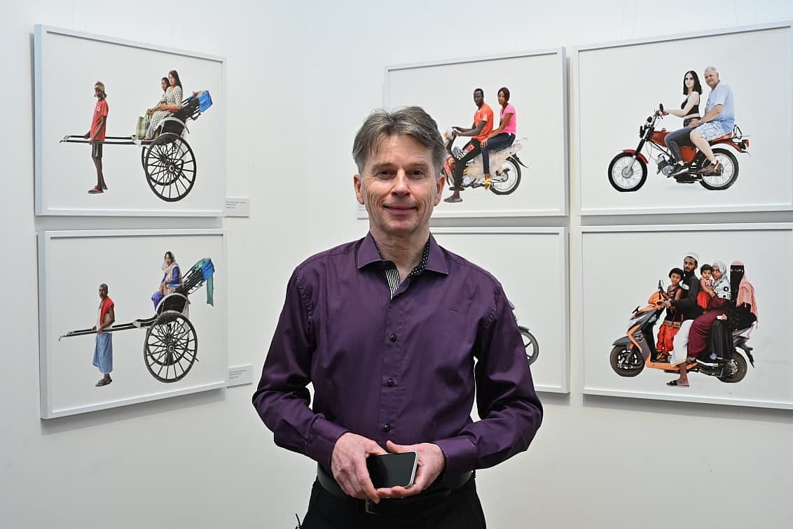 Martin poses with his portraits. 