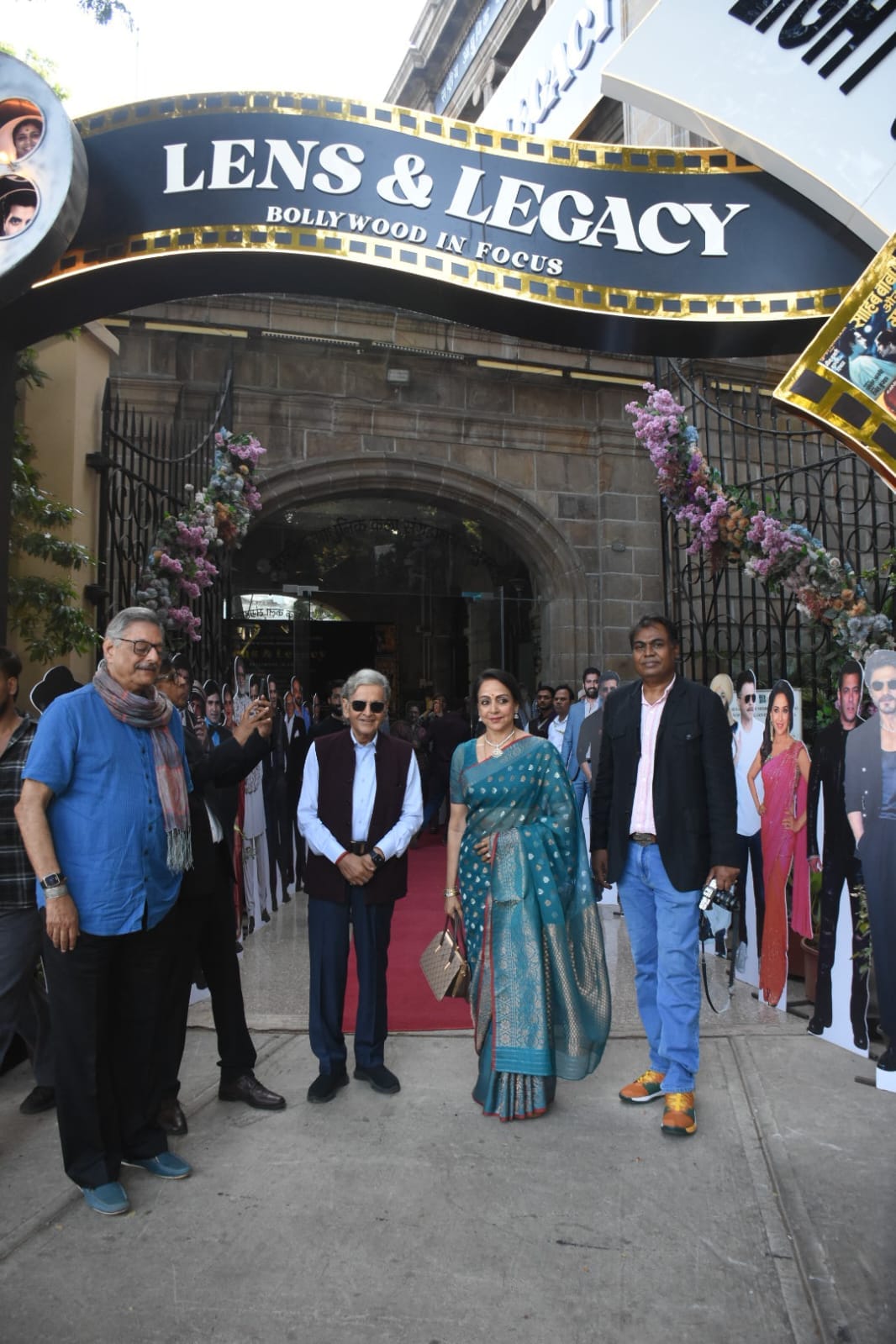 MP & Legendary Actor Hema Malini posing at the Lens & Legacy: Bollywood In Focus with the veteran photographers.