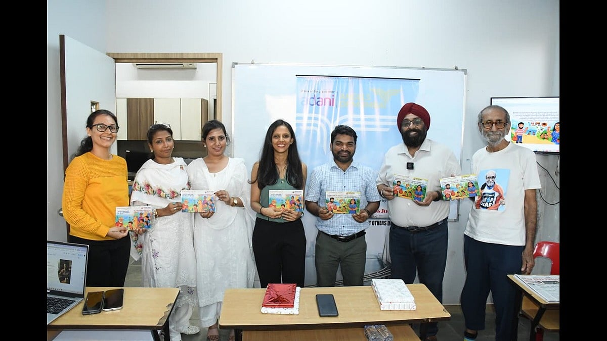 The staff members of DBM India (from left)and Paramjeet Singh, founder of the NGO (second from right) alongside the Angels and the author posing with books
