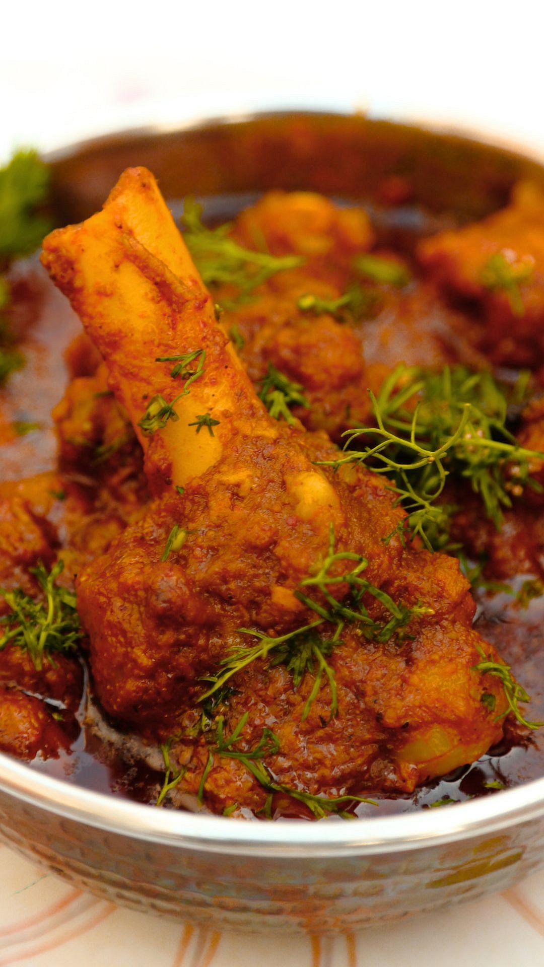 Mutton Korma is a royal-style curry prepared with tender meat, yoghurt, nuts, and rich spices, commonly served during Eid celebrations.