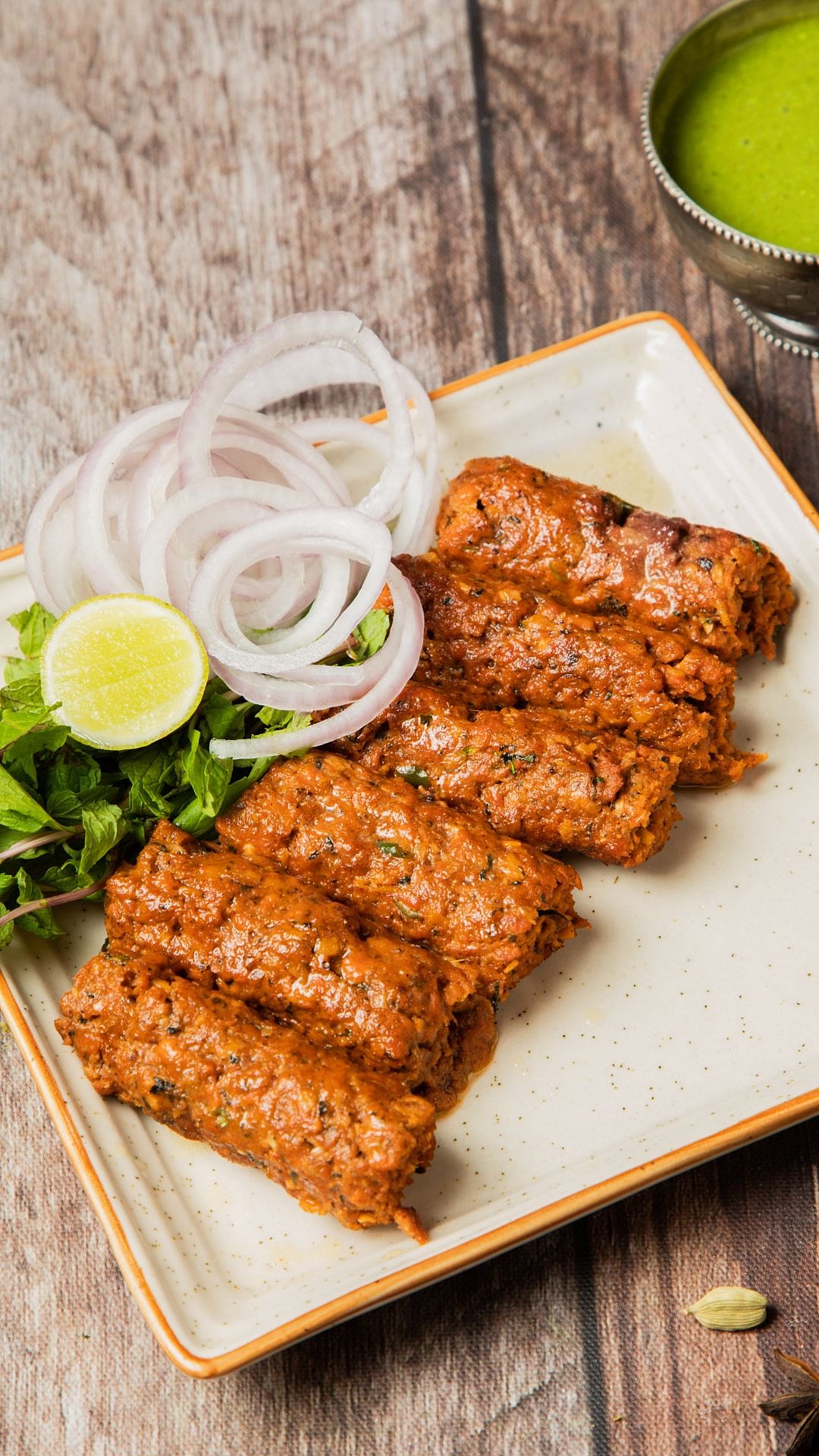 Seekh Kebabs are minced meat mixed with aromatic spices, formed into skewers, and grilled to perfection for Eid gatherings.