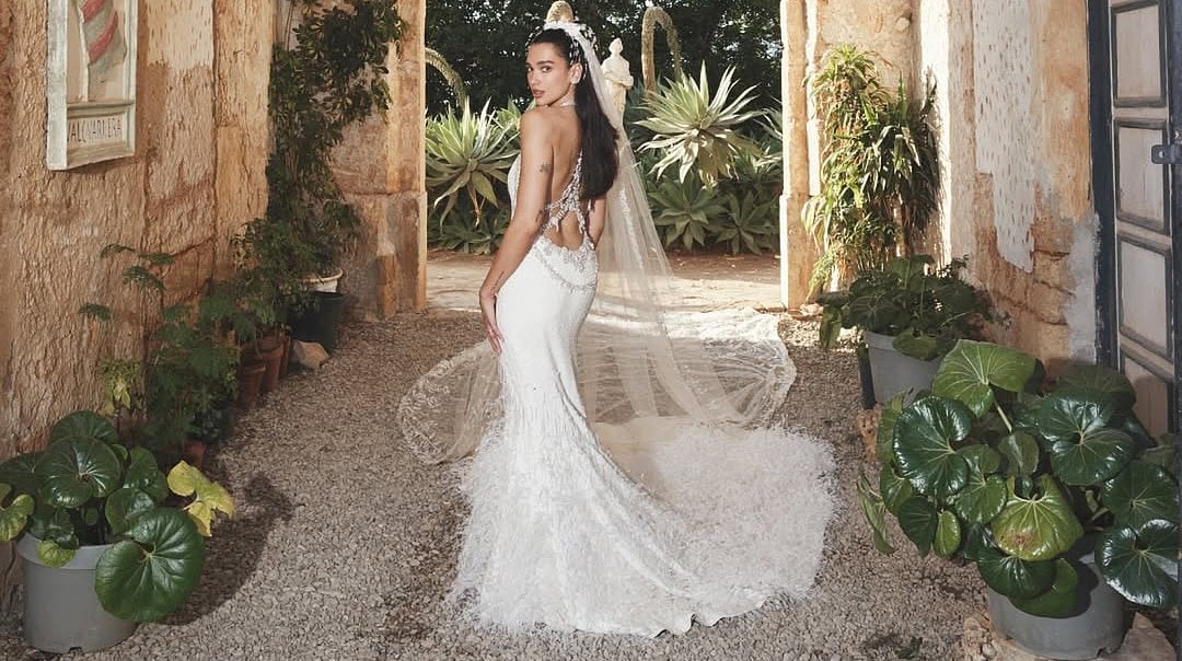 Dua Lipa's Chanel Bridal Gown For Italy Wedding To Callum Turner Features 25,000 Feathers & 480,000 Beads