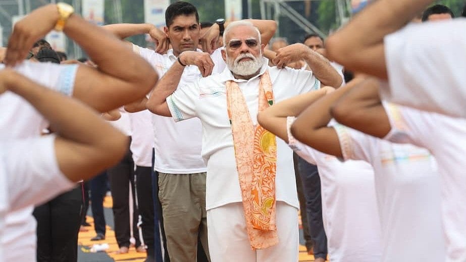 PM Narendra Modi Dons Saffron Scarf In Simple And Relaxed All-White Look At Grand International Yoga Day Event In Kolkata