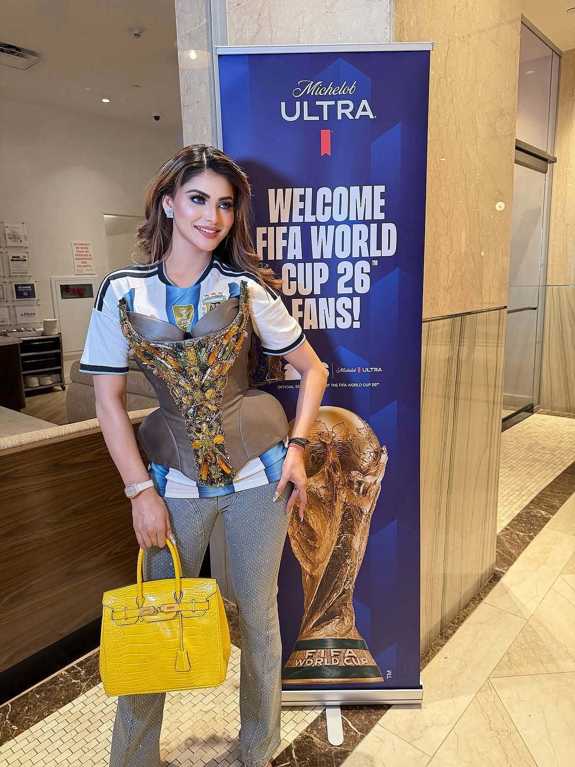 The unique fusion of a football jersey with high-fashion corsetry perfectly blended sports fandom with luxury styling, making it one of the most eye-catching celebrity looks from the World Cup celebrations.