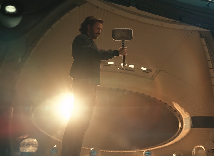 Captain America wielding Thor's hammer