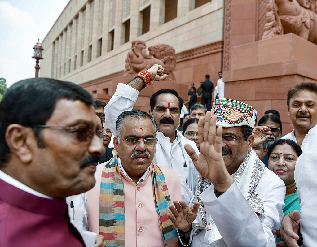 Former Union Education Minister and BJP MP Dharmendra Pradhan arrives at Parliament as BJP-NDA MPs welcome him during the Monsoon Session, in New Delhi on Monday. (ANI Photo)