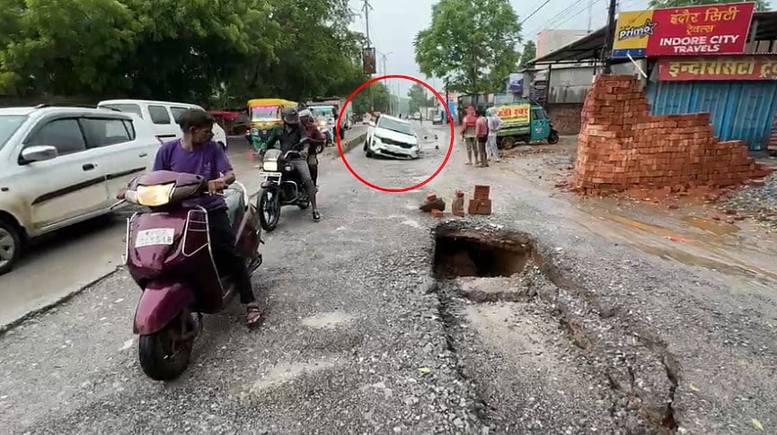 Section Of Gwalior's Busy Road Caves In After Heavy Rain, Car Gets Trapped In 10-Foot-Deep Crater | VIDEO