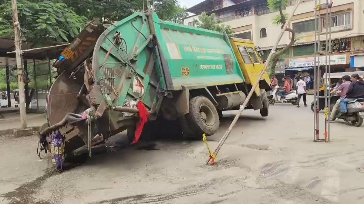 Mumbai: Municipal Garbage Truck Gets Stuck In Drain Cover In Nalasopara, Raising Concerns Over Unsafe City Roads | Video