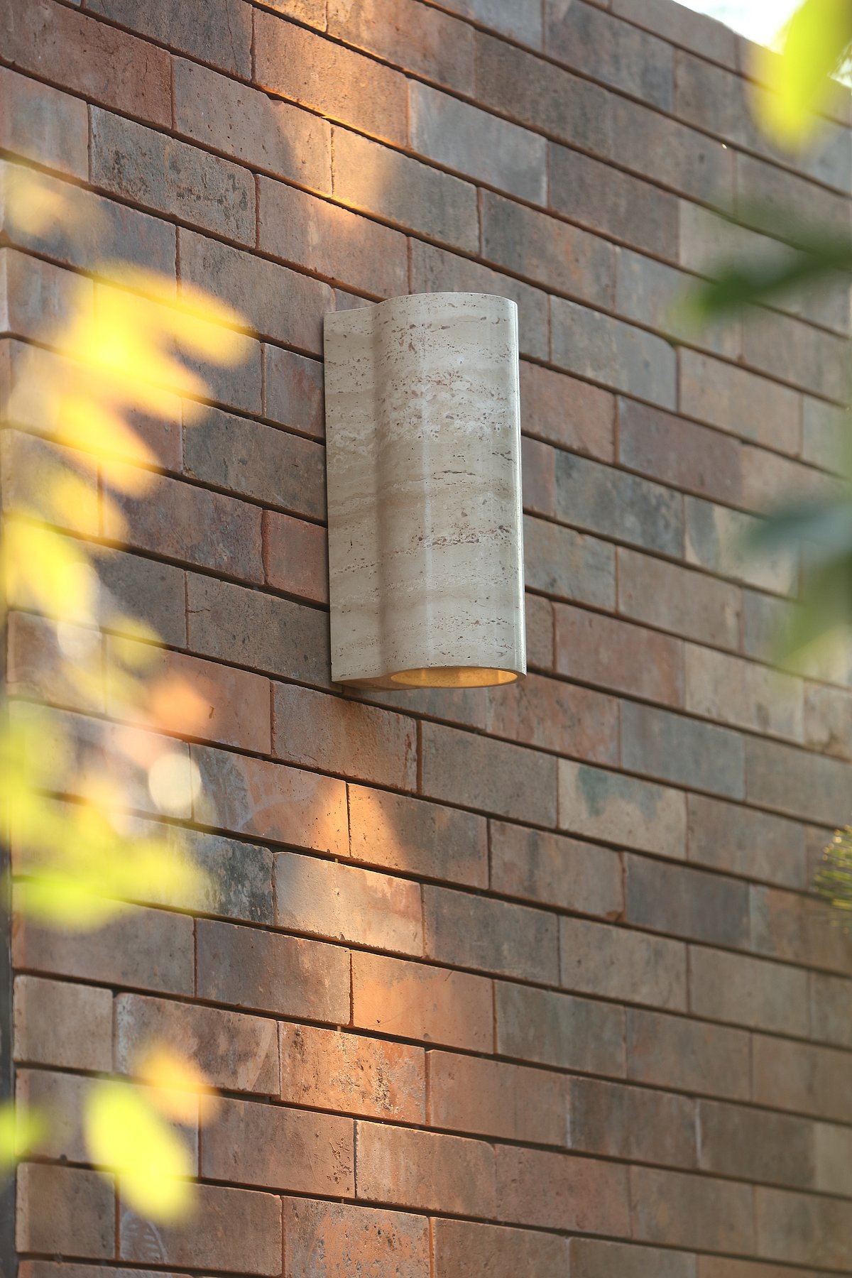 Outdoor wall sconce made of marble by Abner