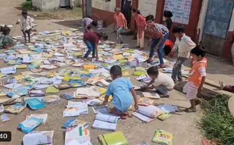 Students Dry Books In Sun After Rainwater Enters Classroom In MP's Dhar | VIDEO