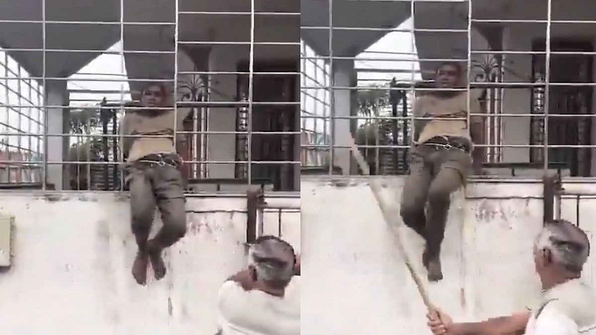 WATCH: Intruder Gets Trapped In Steel Grill While Allegedly Attempting To Enter Locked Bungalow, Beaten by Locals In Surat