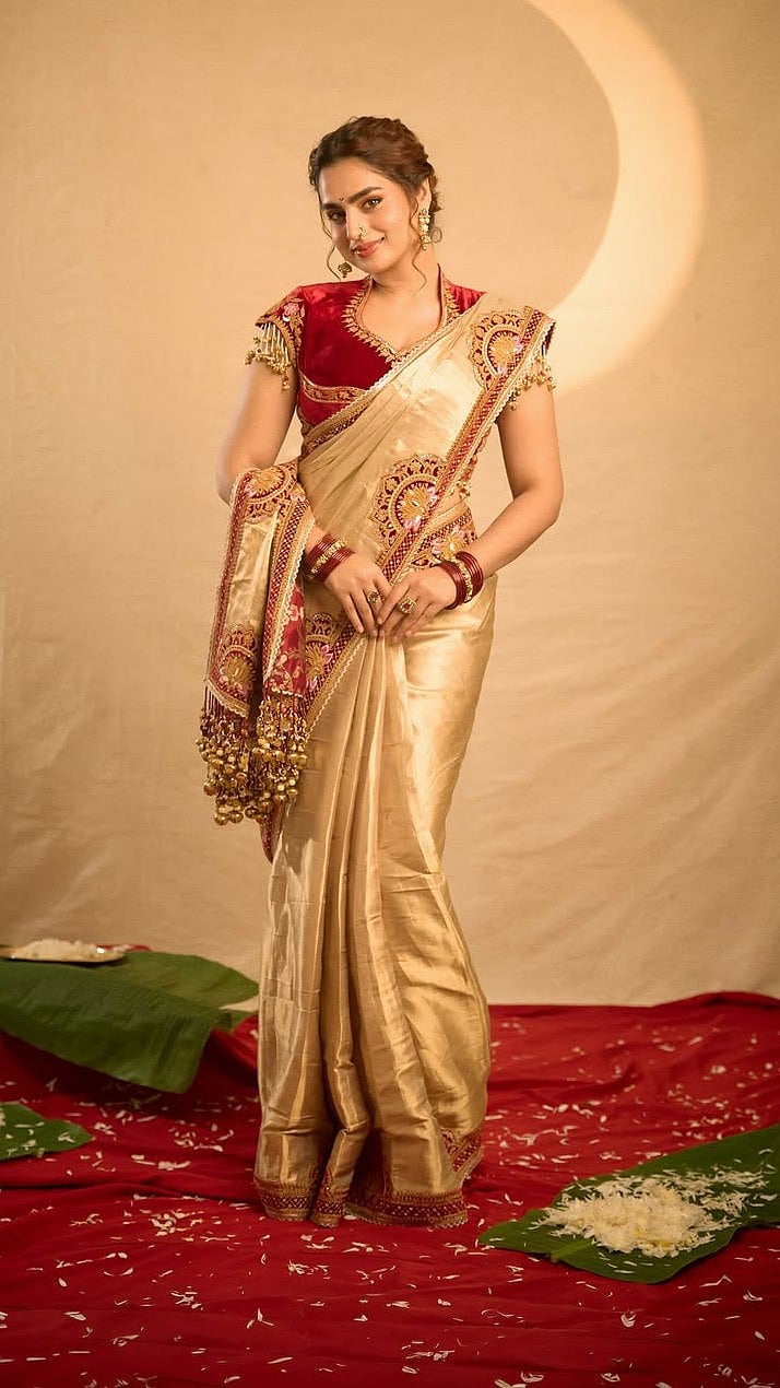 Ayesha Khan embraced a classic Maharashtrian-inspired aesthetic in a lustrous gold silk saree
